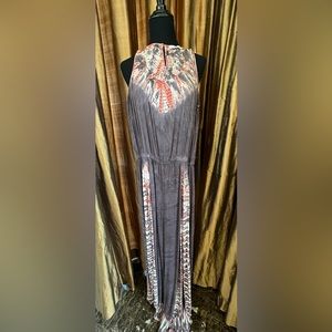 Rayon jumpsuit with front slits.